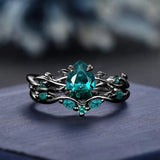 Emera Emerald Ring - pear-cut emerald with vine-inspired metalwork